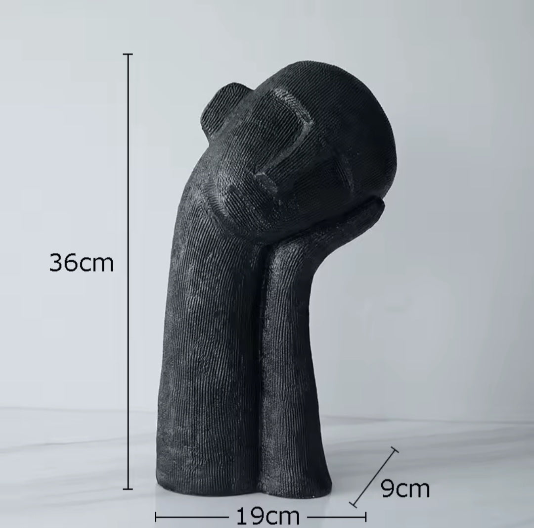 Schlafkopf-Skulptur