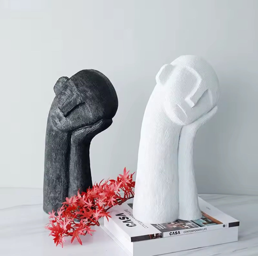 Schlafkopf-Skulptur