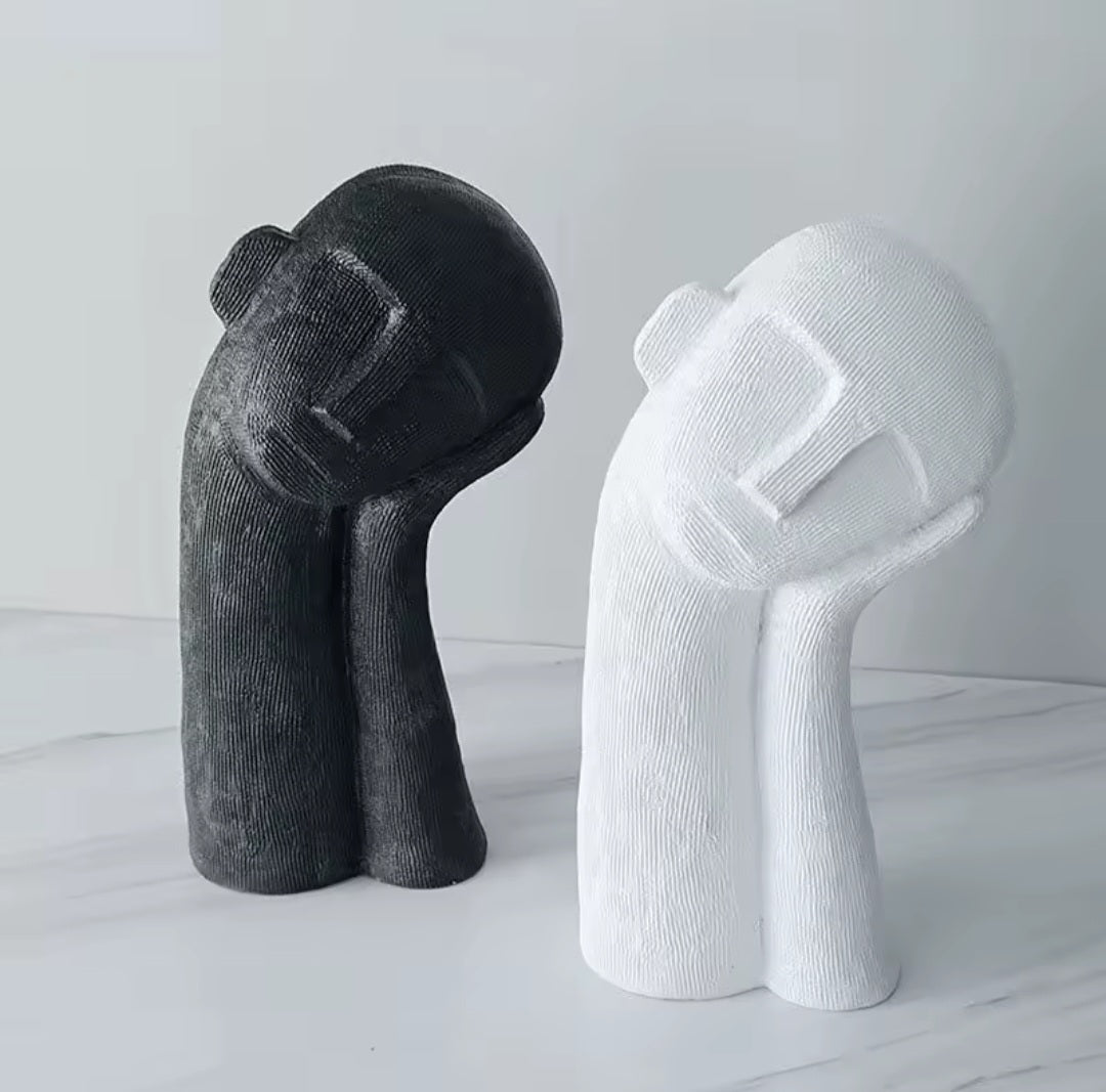 Schlafkopf-Skulptur
